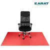 A black office chair is placed on a red floor mat. Náhled obrázku produktu