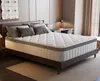 A mattress on a bed frame in a bedroom. Voir les images du produit