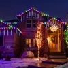A house decorated with colorful LED Christmas lights at night. Produktbild-Vorschau