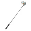 A selfie stick with a phone attached, showing a person taking a selfie. Voir les images du produit