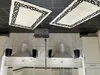 The image shows a kitchen setting with two rugs on the ceiling, a cleaning device mounted on a pole, and kitchen cabinets and hoods. Produktbild-Vorschau