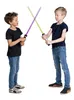 Two young boys are playing with toy lightsabers. Produktbild-Vorschau