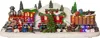 A festive Christmas train scene with Santa, gifts, and decorated trees, illuminated by LEDs. Podgląd zdjęcia produktu