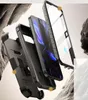 Exploded view of a phone case with a belt clip and screen protector, set against a rocky background. Náhľad obrázku produktu