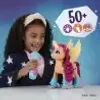 A young girl is playing with a My Little Pony toy. Produktbild-Vorschau