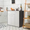 A modern sideboard or kitchen cabinet with drawers and doors, set against a tiled wall in a kitchen or dining area. Anteprima dell’immagine prodotto