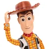 A close-up studio shot of a Woody doll from Toy Story, wearing his signature cowboy outfit and hat. Náhľad obrázku produktu