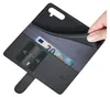 A hand is holding open a black leather wallet-style phone case, revealing credit cards and a 20 Euro banknote inside. Produktbild-Vorschau