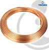 A coil of copper tubing on a white and gray background. Produktbild-Vorschau
