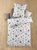 A bedding set with a star pattern is laid out on a textured surface. Produktbild-Vorschau
