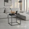 A modern living room scene with a sectional sofa and a small side table. Produktbild-Vorschau