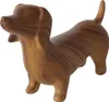 A wooden figurine of a dog on a white background. Podgląd zdjęcia produktu