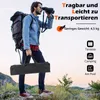 A man with a backpack is looking through binoculars while holding a black carrying bag. Produktbild-Vorschau