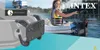 A woman is using an Intex motor mount on an inflatable boat on a lake. Produktbild-Vorschau