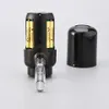 A black electric wine dispenser with batteries inserted and a clear spout, shown next to its black cap on a light gray background. Anteprima dell’immagine prodotto