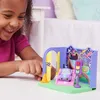 A young girl is playing with a toy playset. Náhľad obrázku produktu
