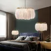 A bedroom with a bed, curtains, and multiple feather lamps. Podgląd zdjęcia produktu