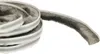 A coiled roll of weatherstripping with a fuzzy, brush-like edge and a white adhesive backing. Podgląd zdjęcia produktu