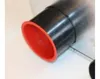 A close-up of a black pipe with a red rim. Produktbild-Vorschau