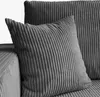 A close-up view of a gray corduroy sofa with two pillows. Produktbild-Vorschau