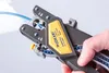 A hand is using a wire stripper tool to strip a blue wire. Anteprima dell’immagine prodotto