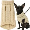 A dog wearing a beige knitted sweater next to a folded version of the same sweater. Náhľad obrázku produktu