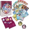A collection of Pokemon trading cards and accessories, including a decorative box, booster packs, individual cards, stickers, and coins. Produktbild-Vorschau