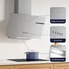 A modern kitchen scene featuring a stainless steel range hood above a cooktop with a pot on it. Callouts highlight product features. Náhled obrázku produktu
