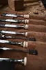 A set of chisels laid out in a leather roll. Anteprima dell’immagine prodotto