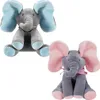 Two plush elephants, one blue and one pink, are shown sitting against a white background. Náhled obrázku produktu