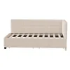 A beige upholstered bed frame with a slatted mattress base, viewed from the side. Anteprima dell’immagine prodotto