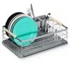 A dish rack filled with plates, glasses, and cutlery. Produktbild-Vorschau