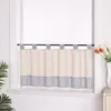 A kitchen curtain hanging on a window rod. Produktbild-Vorschau