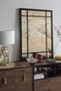 A mirror and a lamp are displayed on a wooden dresser. Produktbild-Vorschau