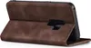 A brown flip cover case for a smartphone is shown from the side, with the cover open. Produktbild-Vorschau