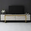 A modern TV stand with a television on top, placed against a dark gray wall. Voir les images du produit