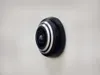 A close-up side view of a black and silver WiFi door viewer mounted on a white wall. Produktbild-Vorschau