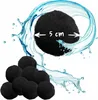 A close-up of black filter balls with a water splash effect and a size indicator. Produktbild-Vorschau