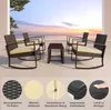 A patio furniture set with chairs and a table on a balcony overlooking the ocean at sunset. Náhled obrázku produktu