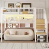 A loft bed with a sofa underneath, decorated with pictures and lights. Náhled obrázku produktu