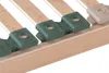 A close-up view of a wooden bed frame with green and beige plastic slat holders. Produktbild-Vorschau