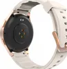 The back of a smartwatch with a white strap and rose gold accents. Voir les images du produit