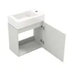 A white bathroom vanity with a sink and an open cabinet door, shown against a white background. Anteprima dell’immagine prodotto