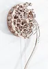 A wooden pendulum clock in the shape of a crescent moon, with intricate gears and mechanisms visible. Voir les images du produit