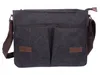 A dark gray canvas messenger bag with brown faux leather accents and a brown strap, shown against a white background. Podgląd zdjęcia produktu