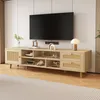 A modern TV stand with a television on top, displayed in a well-lit living room setting. Produktbild-Vorschau