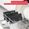 The image shows removable grill plates from a Tefal UltraCompact 3in1 SW383D10 contact grill placed in a dishwasher rack, next to a stack of white plates. Podgląd zdjęcia produktu