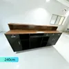 A reception desk in a studio or office setting. Voir les images du produit