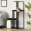 A cat is resting on a multi-level cat tree in a living room setting, next to a sofa and a potted plant. Anteprima dell’immagine prodotto
