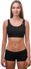 A woman is shown wearing a black sports bra and black shorts against a white background. Podgląd zdjęcia produktu